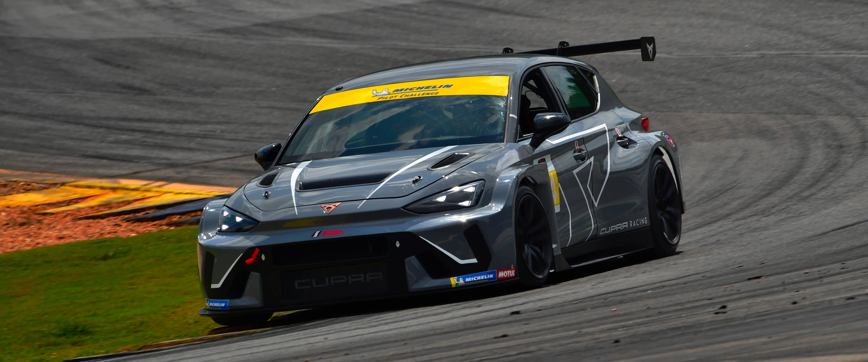 cupra leon vz tcr drifting on a race track during the imsa michelin pilot challenge