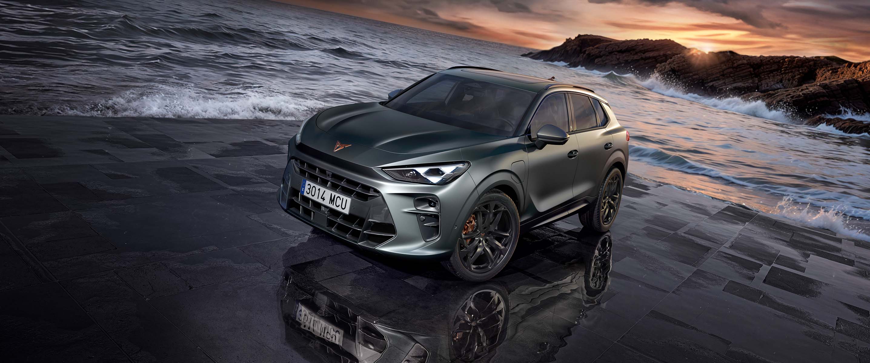 the new cupra terramar 2024 hybrid suv on a wet pavement by the sea, featuring sleek headlights, modern alloy wheels, and a shark-inspired front design