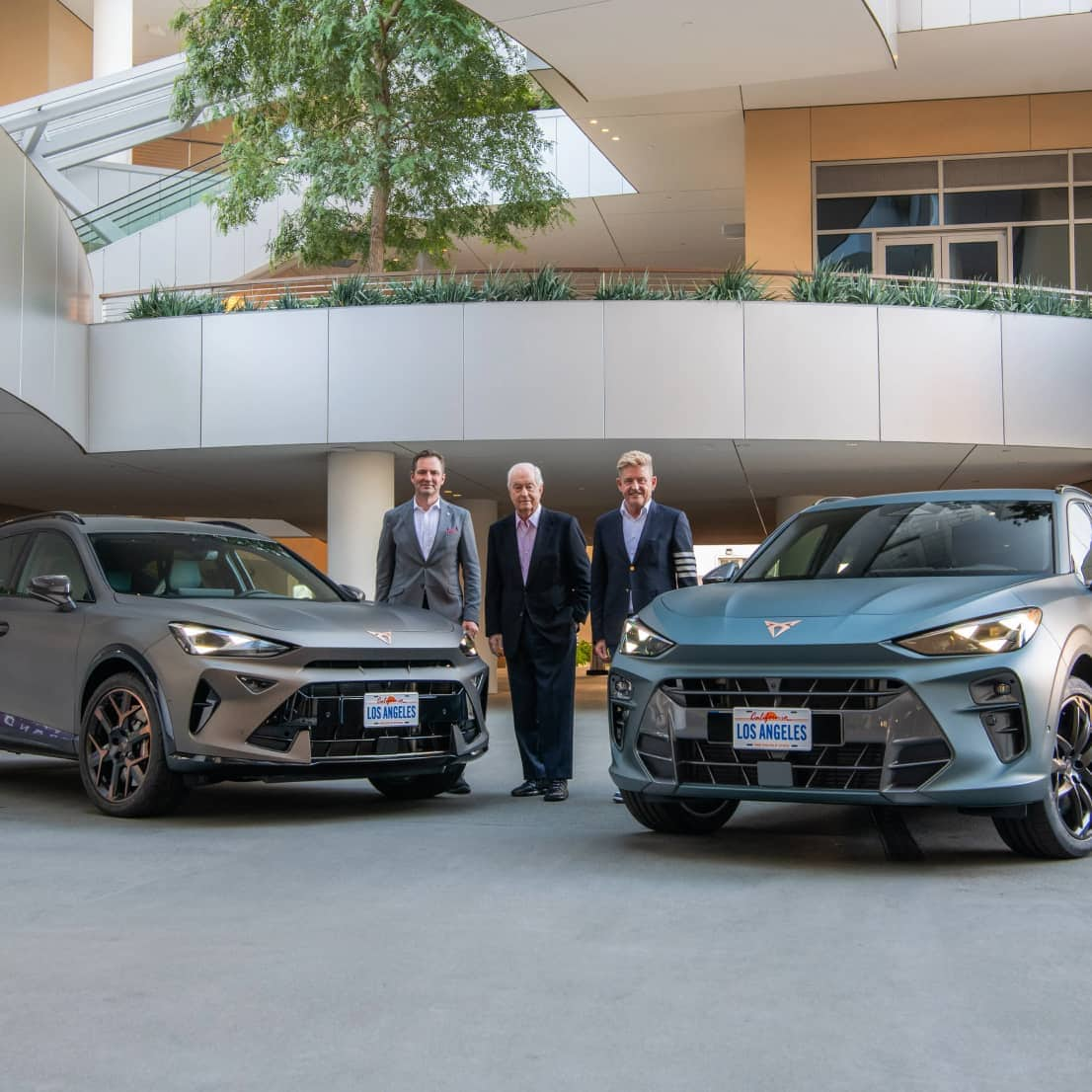 Wayne griffiths, ceo of cupra, thomas schäfer and roger penske in front of the cupra terramar and formentor.