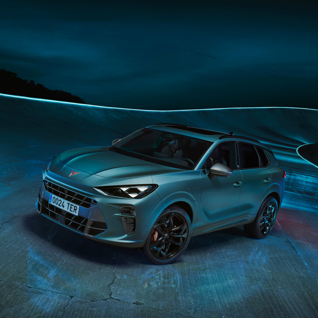 The cupra terramar, a compact suv design and one of the seven finalists for the car of the year 2025 event at the brussels international motor show, displayed under blue lighting.