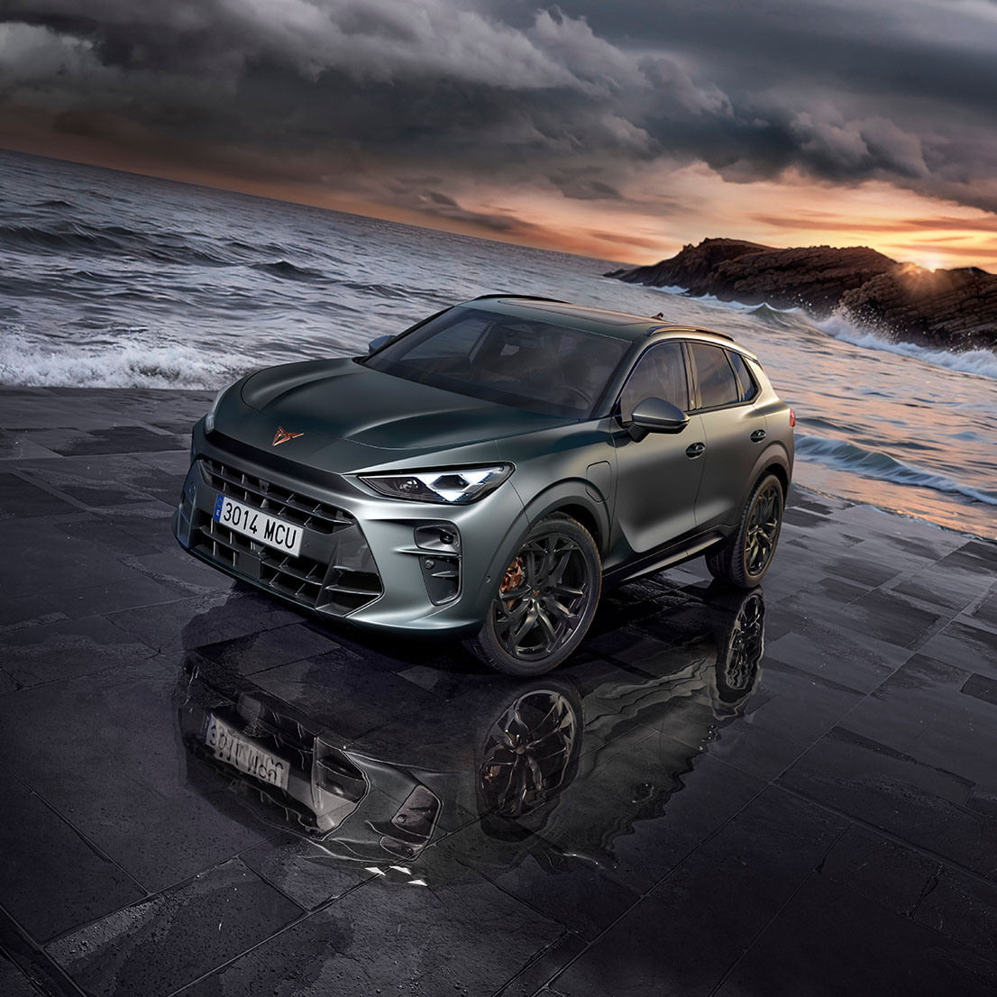 the new cupra terramar 2024 hybrid suv on a wet pavement by the sea, featuring sleek headlights, modern alloy wheels, and a shark-inspired front design