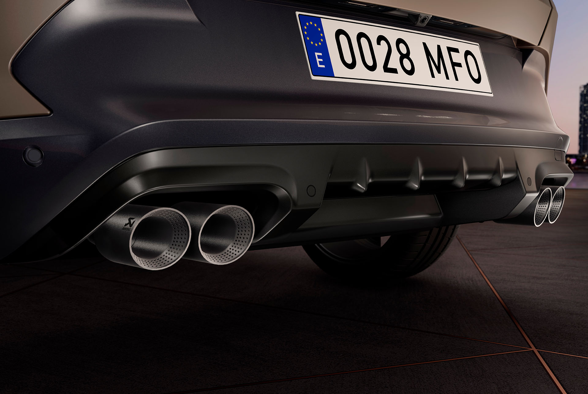 Close-up view of a 2024 CUPRA Formentor's rear. The car features a century bronze matt finish and a sporty design with quad exhausts.