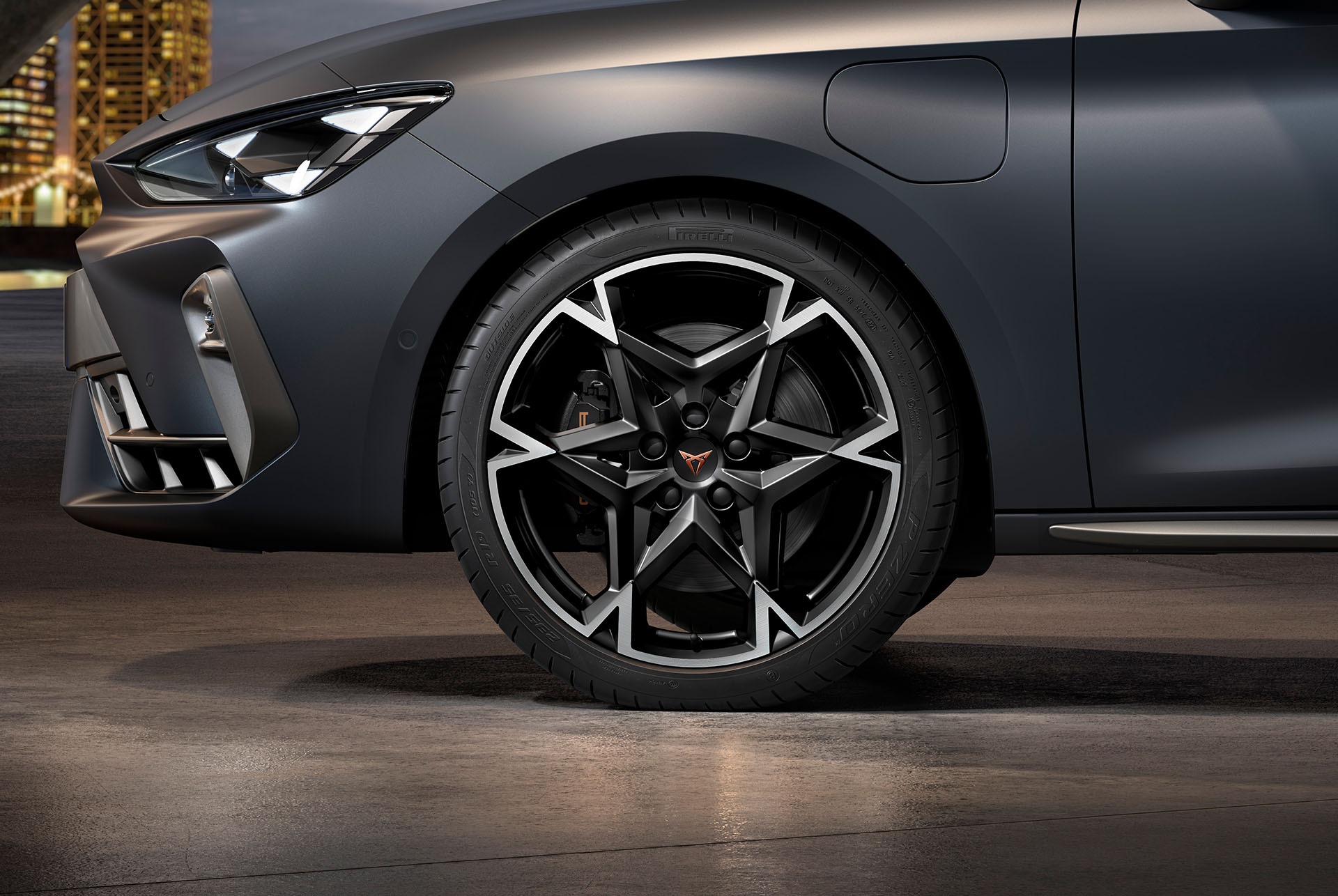 front side view of left machined polar alloy wheel in black and silver for the new cupra leon spotstourer 2024, tyres, signature headlights and grey body