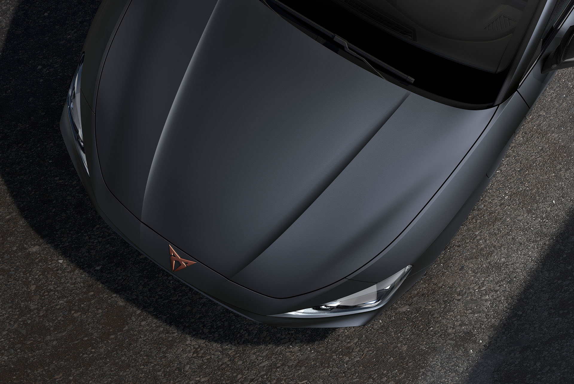 bird’s eye view of a magnetic tech grey matt new cupra leon sportstourer 2024 car hood