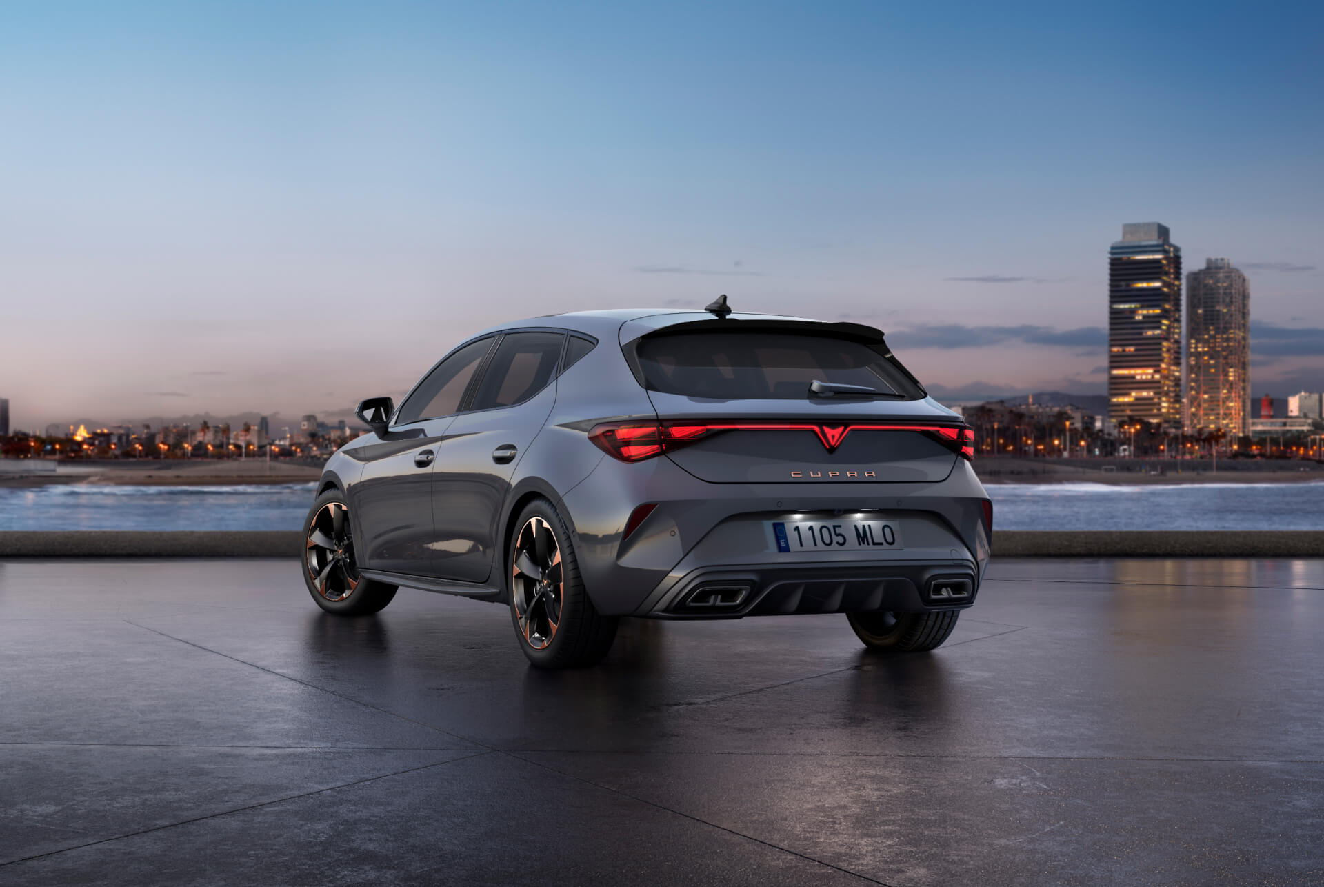 Rear view shot of new cupra leon 2024 glossy grey car model with dynamic chassis control, plus black and copper alloy wheels. City in the background at sunset.