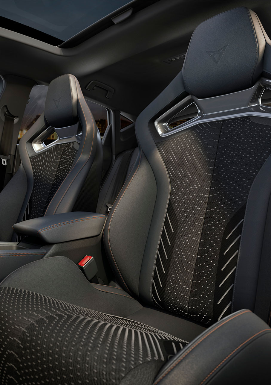 new cupra leon 2024 hybrid car drivers area, includes cup bucket seats, cupra matrix led headlamps, performance brakes and optional forged wheels. steering wheel and city landscapes. 