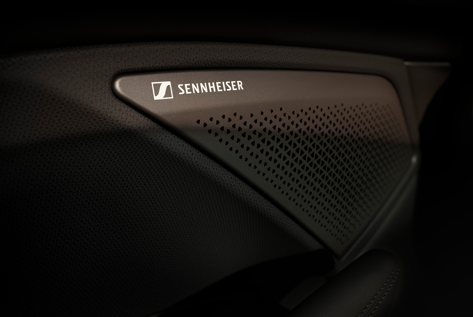 immersive by sennheiser high fidelity 12-speaker audio system in the cupra terramar, showcasing the sennheiser logo. Close up view.