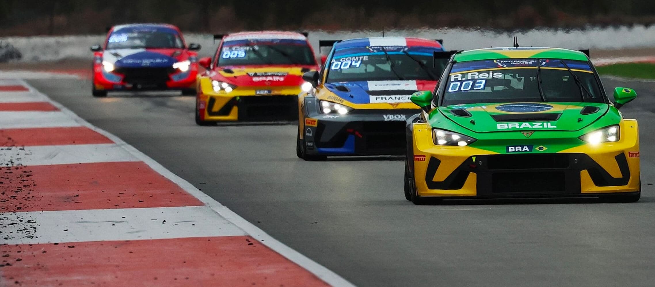 Cupra leon vz tcr race cars competing in the fia motorsport games, with brazil leading ahead of france on the track.